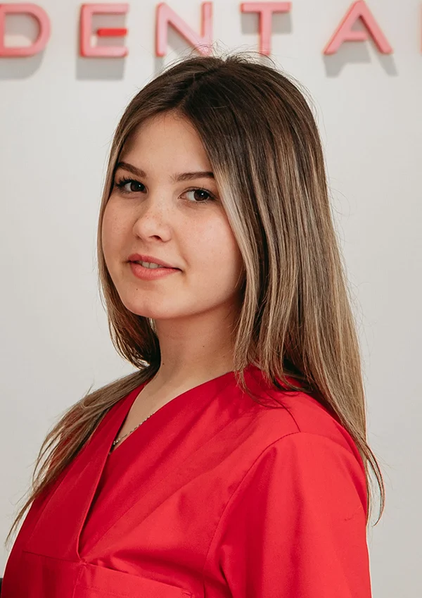 dental hygienist wearing a red shirt